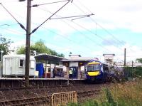 Seen from the Gartnavel Hospital footpath, the 0945 from Edinburgh via Falkirk High passes through Hyndland as it nears the end of its diversion during the period of closure of Queen Street High Level.<br><br>[Colin McDonald 27/07/2016]