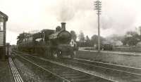 D40 4-4-0 62272 leaving Mintlaw with an up train on 4 July 1951. <br><br>[G H Robin collection by courtesy of the Mitchell Library, Glasgow 04/07/1951]