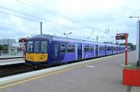 A Northern Electrics service for Preston rolls into Wigan North Western<br>
on 28/06/2016.<br><br>[David Panton 28/06/2016]