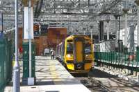 A sunlit Waverley east end on 19 July 2016 sees ScotRail 158733 at platform 3 awaiting departure time with the 1253 service to Tweedbank. <br><br>[John Furnevel 19/07/2016]