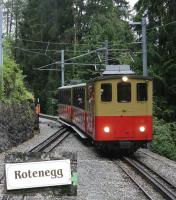 SPB No.20 <I>Gsteigwiler</I> (Edelweiss) propels an ascending train away from the (to UK eyes) unfortunately titled Rotenegg loop towards the tunnel of the same name. The lady seen by the loop points was the guard of the descending train who changed them after No.20 had cleared and then ran down the loop to change the lower set and finally rejoin the train after it was clear. Her enthusiasm was typical of staff all over the Swiss systems. <br><br>[Mark Bartlett 21/06/2016]