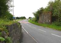 Remains of the railway bridge that once carried the Moffat branch over the A701 on its one and a half mile journey from the junction with the WCML north of Beattock. Moffat station closed to passengers in 1954, with the branch closing completely 10 years later. View is south towards Beattock on 27 July 2016. The last passenger train to cross the bridge was the SLS Easter Railtour of 29 March 1964 [see image 30082].<br><br>[John Furnevel 27/07/2016]