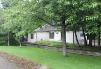 Dornoch station in July 2016, still in business use fifty six years after closure and with the platform facing clearly visible. <br><br>[Mark Bartlett 20/07/2016]