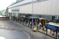 The east end of Waverley seen from the Calton Road footbridge on 19 July 2016. Standing at platform 1 is the 1102 ex-Perth which has recently terminated here. Until the mid 1980s this corner of the station was dominated by the Royal Mail, with an overhead conveyor system from the GPO sorting office on the corner of North Bridge and Waterloo Place linking into the distribution centre that stood on the other side of platform 2. During that period the area in the foreground was invariably occupied by Royal Mail vans [see image 6021]. <br><br>[John Furnevel 19/07/2016]