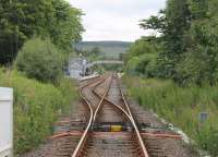 Lairg, as seen from the A836 level crossing to the north of the station. Beyond the STOP boards the trailing connection to the oil terminal, still served by a weekly train, can just be seen [See image 16427].  <br><br>[Mark Bartlett 21/07/2016]