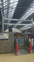 A view from the concourse through the relocated gates to the new catenary at High Level Queen Street.<br><br>[John Yellowlees 08/08/2016]