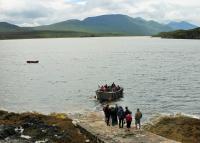 The tiny Cape Wrath Ferry leaves the slipway at Keoldale with a full complement of passengers to cross the Kyle of Durness. However, it will have to make an additional trip for those left behind. On the far side of the Kyle the ferry connects with minibuses that take the passengers along the isolated twelve mile road to Cape Wrath lighthouse on the north west tip of mainland Scotland.<br><br>[Mark Bartlett 22/07/2016]