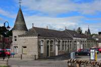 Former Aboyne Station.This is the platform side where trains would have stopped. View looking east. The building houses a variety of small businesses,and,in common with many closed stations,the area round the building is now a car park.<br><br>[John Gray 27/07/2016]