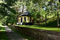 A victim of the Beeching cuts,The Deeside Line closed in 1966. It ran from Aberdeen to Ballater and was used by Queen Victoria and subsequent royals on their trips to Balmoral Castle.Cambus O' May was a small single platform station four miles east of Ballater. The picture shows the former station as it is today. The building is the original and is now privately owned. View looking west.<br>
<br>
John.<br>
<br>
<br><br>[John Gray 27/07/2016]