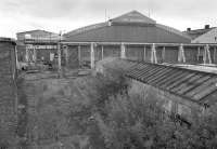 Looking south over the closed portion of the Motherwell Bridge and Engineering works from the Logan Road footbridge.  The WCML passes to the left. [See image 4468]<br><br>[Bill Roberton 01/08/1992]