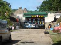 Earlier than indicated the new Haigh Lane bridge assembly has been transported from its casting and assembly site to left of view, and is seen still being supported above the remaining lower section of the support walls from the removed arch bridge. All looks to have fitted together as required, although the new abutments overhang on the corners where the remaining stonework has a contoured profile to the wing walls. <br><br>[David Pesterfield 06/08/2016]