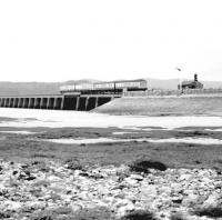 A DMU about to come off the Kent Viaduct at Arnside in the autumn of 1983, having almost cleared the last of the 50 spans of the 1857 structure. The rear two coaches of the train are on the original telescopic opening span.  <br><br>[John Furnevel 07/10/1983]