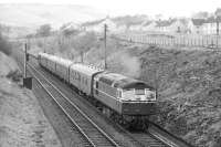 A Type 2 with an up stopping train passing through Langlee in April 1963 shortly after leaving Galashiels station.<br><br>[Dougie Squance (Courtesy Bruce McCartney) /04/1963]