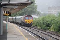 66128 heads east through Port Talbot with a Trostre to Margam Yard empties on the up goods line.<br><br>[Alastair McLellan 15/07/2016]