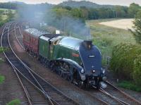 A4 60009 passes Inverkeithing East Junction with a support coach, heading from Thornton Yard to NRM Shildon on 18 July.<br><br>[Bill Roberton 18/07/2016]