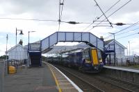 1202 SX Ayr to Central rolls under the repainted footbridge. The whole station has had a makeover - if the station gets done up, the Open must be coming.<br><br>[Colin Miller 27/07/2016]