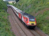 VTEC power car 43312 nears Aberdour with the 10.00 from London KX to Aberdeen. The 12.47 ScotRail service from Aberdeen to Edinburgh disappears round the bend.<br><br>[Bill Roberton 07/08/2016]