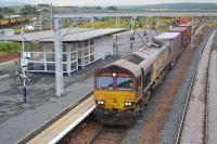 66100 passes Carstairs Station with a Tees Dock - Mossend intermodal.<br><br>[Bill Roberton 12/08/2016]