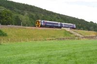 Then and now. The 1229 Tweedbank – Edinburgh passes the site of Bowland station on its way north on 4 August 2016. Some 52 years earlier Robin Barbour stood on the same spot in this same field and took a much more interesting photograph, which remains one of my Railscot favourites [see image 25514]. <br><br>[John Furnevel 04/08/2016]