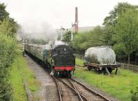 BR Standard 4MT 2-6-4T 80080 approaches Ramsbottom with a train from Rawtenstall to Heywood on 3rd August 2016. The fireman is holding the single line token outside the cab, ready to be collected by the Ramsbottom signal man <br><br>[Mark Bartlett 03/08/2016]