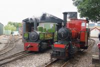 Visiting Hudswell Clarke locos from Statfold Barn Railway are seen  at the West Lancashire Light Railway on 14 August 2016. On the left is 0-6-0T works number 1172 of 1922 'Alpha' while 0-6-0WT works number 1643 of 1930 backs onto the train in the platform.<br><br>[John McIntyre 14/08/2016]