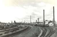 View over Ardrossan North station in August 1960, looking towards the harbour. The station had closed to passengers in 1932. [See image 51717]<br><br>[G H Robin collection by courtesy of the Mitchell Library, Glasgow 24/08/1960]