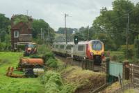 A Virgin Voyager on a London bound service approaches the site of Bay Horse station on the WCML between Preston and Lancaster. The station Opened in 1840 and closed in 1960 but 56 years later there is still evidence of it [see image 19844], even when it is next to the WCML!<br><br>[John McIntyre 20/08/2016]