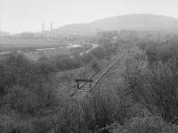 Looking north to Waterside/Dunaskin with the buffer stop at the southern extremity of the Dalmellington branch in the foreground. The left hand track is the cut back line to Dalmellington and those to the right the Cutler Sidings laid in by the LMS.<br>
<br>
<br>
B<br>
<br>
<br>
<br>
nothing more on Clachnaharry yet.<br>
<br>
<br><br>[Bill Roberton //1988]