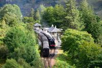 Both 'The Jacobite' trains pass each other at Glenfinnan. Black 5 No.44871 is hidden by the trees heading back to Fort William, and, sister engine 45407 has just arrived with the afternoon train to Mallaig.<br><br>[John Gray 24/08/2016]