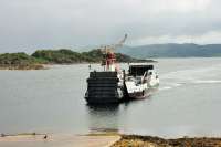 Calmac <I>MV Isle of Cumbrae</I> starts to lower the ramp as it approaches the Tarbert slipway after yet another crossing from Portavadie on 25th July 2016. Celebrating its 40th birthday in 2016 this vessel is now the oldest in the fleet that is still in regular front line service.  <br><br>[Mark Bartlett 25/07/2016]