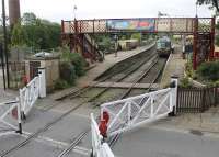 Signalman's view of Ramsbottom level crossing and the station on 3rd August 2016 as the gates are closed across the road to allow a DMU to depart for Rawtenstall. View from the cabin taken during a supervised visit. <br><br>[Mark Bartlett 03/08/2016]