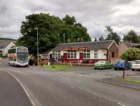 There wasn't much to Cardrona when the railway arrived: just an adjacent mains and nearby  Horsburgh Castle Farm. Some public housing appeared between the wars, then a large golf hotel was built over Horsburgh Castle Farm and there has been some more recent housing. Despite this growth the old station seems no longer to be the village store but 'Nashy's Coffee House'. Local lads turn up  to find that the X62 on the Edinburgh to Melrose route isn't going their way. The half-hourly service is not something the railway could have ever matched, I venture.<br><br>[David Panton 05/07/2015]