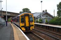 A Glasgow - Edinburgh service calls at Shotts in late August 2016. It is about to pass under the Station Road overbridge (left background) which will be replaced as part of the electrification works.<br><br>[Colin McDonald 31/08/2016]