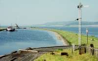 View from a passing train crossing Clachnaharry swing bridge. Early 1970s. The signal appears to be for canal traffic. (The vessel in the background is the Eilean Dubh, one of the Kessock ferries, at that time held in reserve. With thanks to Colin Miller).<br><br>[Bill Roberton //197X]