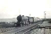 Looking south towards Tillynaught Junction on 17 April 1954 as K2 2-6-0 61792 pulls away with a train for Elgin via the coast. [Ref query 49762]  <br><br>[G H Robin collection by courtesy of the Mitchell Library, Glasgow 17/04/1954]