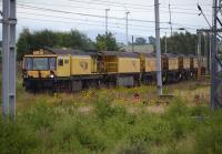 LORAM rail grinder C2101/DR79231 stabled at Carstairs on 12 August.  The former loco yard is covered by weeds.<br><br>[Bill Roberton 12/08/2016]