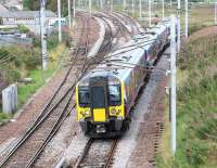 TransPennine 350404 comes off the Carstairs avoiding line at Carstairs South Junction on 31 August 2016 and joins the WCML. The train is the 1212 Edinburgh Waverley - Manchester Airport. <br><br>[John Furnevel 31/08/2016]