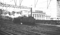 The station approach to Glasgow Central on Saturday 30 July 1966, featuring Jubilee 45675 <I>Hardy</I>, seen here shortly after backing out of the platforms on its way to 66A. The 4-6-0 had arrived earlier on train 1S67, the 9.20am St Pancras - Glasgow <I>Thames Clyde Express</I> relief service.<br><br>[K A Gray 30/07/1966]