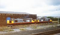 On a cloudy summer's day at Blackburn Station two BR Type 3 Class 37s (37379 and 37370) in BR Railfreight livery sit beside the old Goods Shed-which company built the shed, L&Y, B&P or some other? <br>
Nowadays this site is occupied by a Vue multiscreen cinema.<br><br>[Charlie Niven /06/1989]