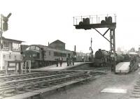 A busy summer Saturday at the north end of Dumfries on 15 July 1961. On the left is 'Peak' D18, some 7 months old at that time, with a down Leeds service. In the centre is Dumfries Black 5 45480 with a stoppping train for Stranraer, while on the right Hurlford based sister locomotive 45010 waits to depart with a Glasgow local.<br><br>[G H Robin collection by courtesy of the Mitchell Library, Glasgow 15/07/1961]