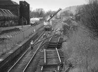 Looking west from the footbridge to the former Cambus station in late 1987.  A new rounding loop is being installed to eliminate the level crossing using materials recovered from Alloa New Yard, behind the camera.  A class 37 waits in the background.<br><br>[Bill Roberton //1987]