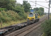 A lightly loaded Coatbridge to Daventry container service gives an opportunity for a south facing shot of Freightliner 70005 from the St. Heliers Place footbridge in Barton. The old station site is at the end of the straight track by the second bridge. <br><br>[Mark Bartlett 10/09/2016]