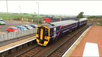 A Glasgow bound Class 158 DMU heads west out of Shotts station and past the SPT car park and BAM Nuttall compound which is a base for the work on replacing the Station Road overbridge.<br><br>[Colin McDonald 14/09/2016]