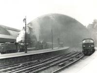 Platform scene at St Enoch on 1 August 1961. Over to the left are station pilots 40620 and 55225, while on the right Peak D19 is preparing to leave with the 4pm to Leeds City.    <br><br>[G H Robin collection by courtesy of the Mitchell Library, Glasgow 01/08/1961]