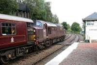 <I>'The Royal Scotsman'</I> runs east through Glenfinnan station on 25 September 2005 on its way back from Mallaig to Fort William. The locomotive is WCRC 37197 <I>Loch Laidon</I>.<br><br>[John Furnevel 25/09/2005]