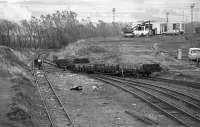 Millerhill Mishap. Looking south from Whitehill Road over the former Up yard.  A long wheelbase wagon has split the points. The Up Hump Yard office is in the background. All the track, the realigned up arrival sidings, would be lifted in later years. The new EGIP electric depot will be built on this site. <br>
<br>
The engineer's yard was to close with all ballast trains originating at Mossend, then it was reprieved and trains used Millerhill for a while, now everything is back at Mossend. With the EGIP depot construction has the engineers yard gone?  It would appear that the only functioning place is the wagon shop, for stabling of steam locos!<br><br>[Bill Roberton //1978]