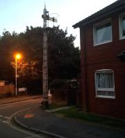 Another view of the now-incongruous signal at Braunton [see image 56400]. The railway path to Barnstaple resumes to the right of the street sign in the background.<br><br>[Ken Strachan 28/08/2016]