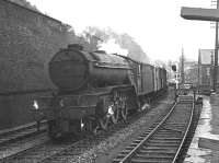 V2 2-6-2 60813 northbound through Galashiels with a freight on an overcast day in 1965. The train is about to pass the siding serving Paterson's Wood Yard.<br><br>[Dougie Squance (Courtesy Bruce McCartney) //1965]