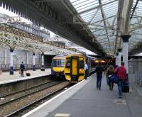 The set at Platform 7N (left) was destined for Inverurie but late running caused by a track circuit failure at Carmont meant it was terminated here. Turfed-off passengers (including me) make their way to the Inverness service at 6N.<br><br>[David Panton 28/09/2016]