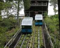 The water balanced cliff lift is the main access route for visitors to the Centre for Alternative Technology near Machynlleth. Using water from one of the many nearby streams cars <I>Annie</I> and <I>Martha</I> lift visitors up the 180' from the car park to the main site in the old quarry above. Note the viewing platform in front of the winding house. <br><br>[Mark Bartlett 19/09/2016]